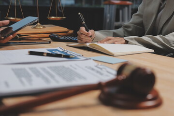 Consultation and conference of professional businesswoman and Male lawyers working and discussion having at law firm in office. Concepts of law, Judge gavel with scales of justice