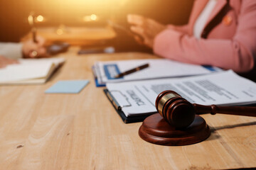 Consultation and conference of professional businesswoman and Male lawyers working and discussion having at law firm in office. Concepts of law, Judge gavel with scales of justice