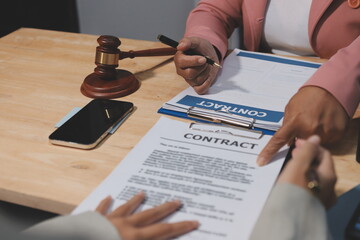 Consultation and conference of professional businesswoman and Male lawyers working and discussion having at law firm in office. Concepts of law, Judge gavel with scales of justice