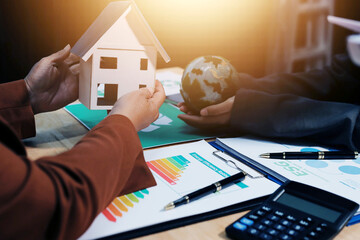 Asian woman lead young group of multiethnic businesspeople in team meeting, using laptop computer for ESG topic presentation on monitor. Sustainable business practice, people work at home concept