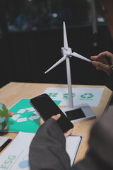 Asian woman lead young group of multiethnic businesspeople in team meeting, using laptop computer for ESG topic presentation on monitor. Sustainable business practice, people work at home concept