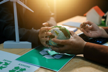Asian woman lead young group of multiethnic businesspeople in team meeting, using laptop computer for ESG topic presentation on monitor. Sustainable business practice, people work at home concept