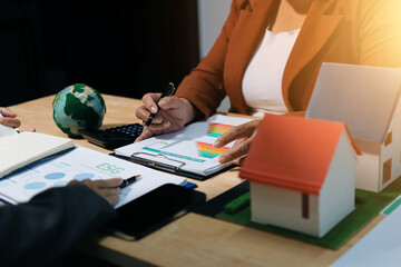Asian woman lead young group of multiethnic businesspeople in team meeting, using laptop computer for ESG topic presentation on monitor. Sustainable business practice, people work at home concept