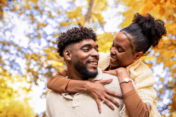  Couple Sharing Loving Autumn Piggyback Moment