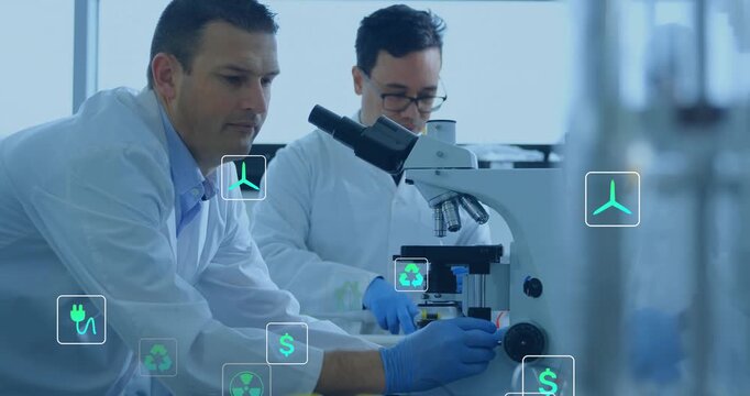 Scientists in research lab adjusting focus for visualizing floating energy icons around microscope