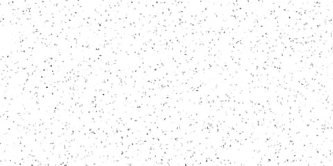 Subtle mosaic pattern of scattered grey and white irregular polygonal shapes creating a textured abstract background for design and decoration