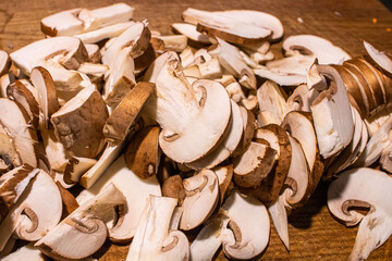 sliced mushrooms on a cutting board.