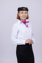 Stewardess in uniform posing for camera