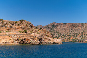 Exploring the historical beauty of Spinalonga island in Crete, Greece under clear skies