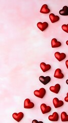 Obraz premium Scattered red hearts on pink textured background love