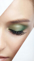close up of female eye with green make up
