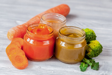 baby vegetable puree on wooden background