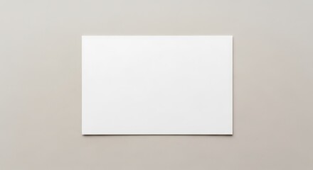Fototapeta premium Blank white canvas or paper centered on a plain, neutral background, ready for artistic creation or a minimalist presentation, evoking simplicity and potential
