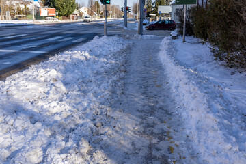 Winter urban infrastructure with plowed sidewalk and snow-covered streets
