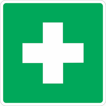 A green square sign with a white cross symbol, indicating medical or first aid services.