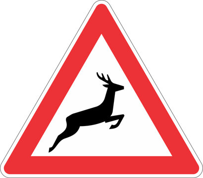 A triangular road sign warning of deer crossing the road ahead.
