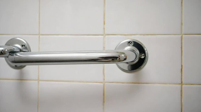 Safety grab bar in a bathroom for senior people.