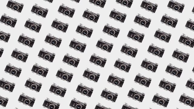 Background with retro photo cameras on a white bg. 4K