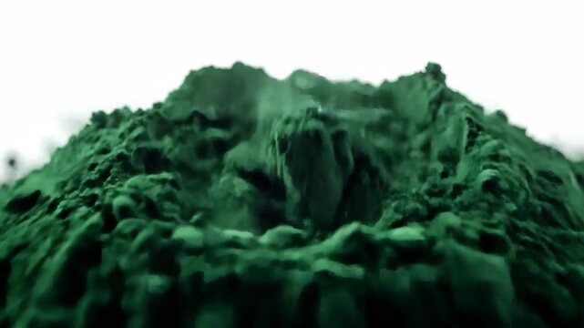 Pile of vibrant green spirulina powder, a nutrient-rich superfood supplement on white background.
