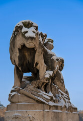 Paris, France - 01 06 2026: Snow flakes. Detail view of Alexander III bridge with sculpture of a lion and Eiffel Tower behind under the snow and blue sky