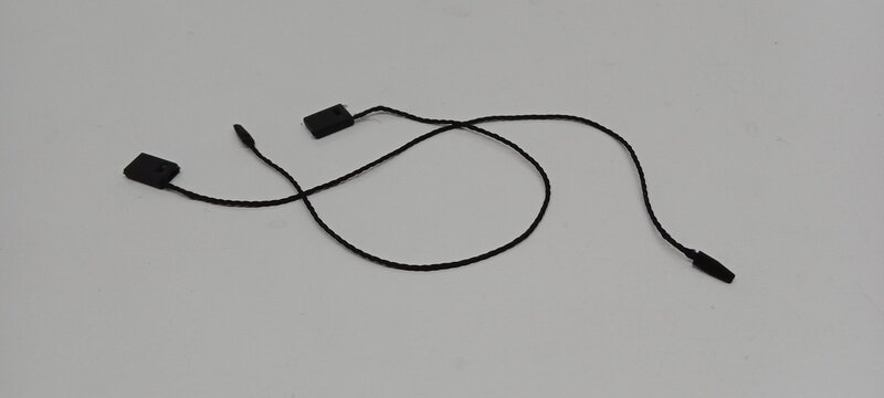 Black hangtag thread piled on a white background