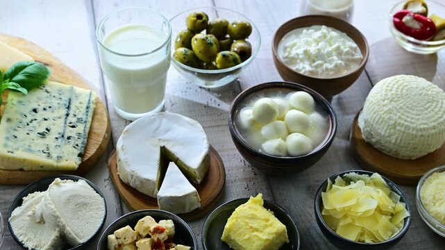 A variety of dairy products including cheese, milk and yogurt.