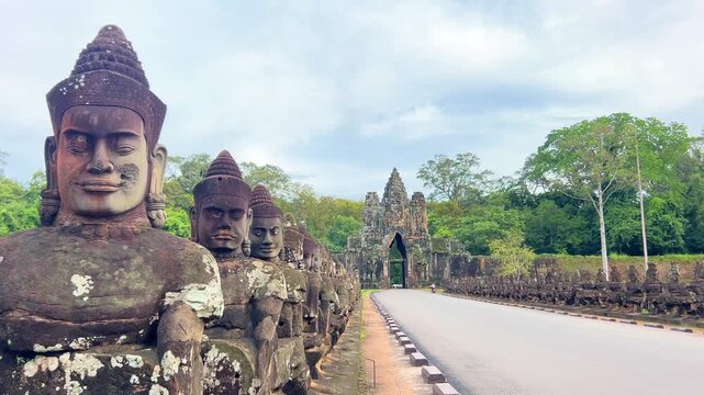 Siem Reap, CAMBODIA - September 15, 2025: View of the Angkor Thom Gate, adorned with massive stone smiling faces. The entrance to the ancient city, the former capital of the Khmer Empire. 4К