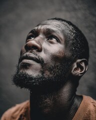 man looking upward slightly, contemplation emotion