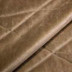 Fototapeta premium Brown quilted velvet texture with diagonal stitching and soft plush surface for fashion and interior design