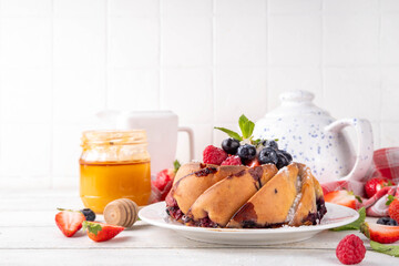 Sweet summer bundt cake with fresh fruit and berry