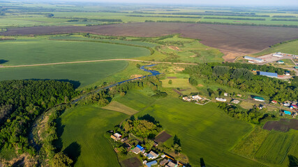Rural landscape, agricultural fields, rural nature, agricultural sector of the economy, spacious views of fields and natural areas, pastoral motif of the Russian village. High quality photo
