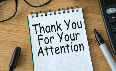 Thank You For Your Attention text on a spiral notebook.
