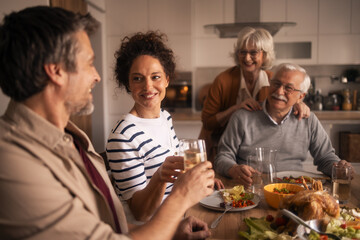 Multi-generational family enjoying a celebratory meal together