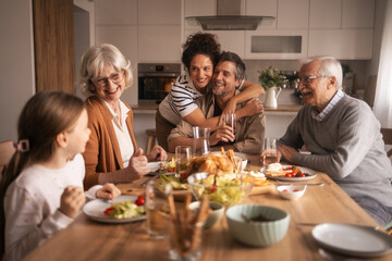 Family enjoying a multi-generational lunch together at home