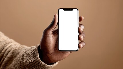 Close-up of a hand holding a smartphone with a blank screen.