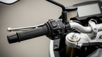 Close-up of a motorcycle handlebar with control switches and brake lever.
