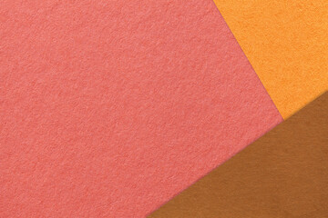 Fototapeta premium Abstract coral, orange and brown paper background with copy space. Template for presentation, banner, card design