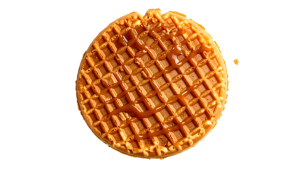 A close-up view presents a single, golden-brown waffle, perfectly round. It?s topped with a generous drizzle of caramel sauce, glistening