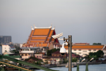 CCTV on city near river installed on the bridge