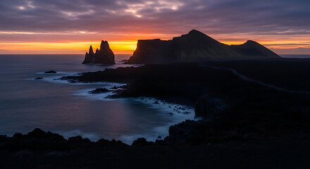 A serene landscape of rocky coastline and ocean at sunset