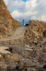 Woman walking on path, in Spain