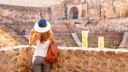 Woman tourist exploring Cartagena city, Roman theatre at Spain