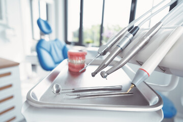 Closeup of dental surgical tools on a tray.