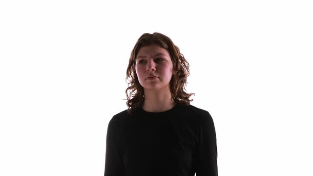 Young woman in black top isolated on white background rotating. Concept of immersive storytelling, editorial visuals, digital magazines, and narrative driven media projects.