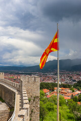 Fototapeta premium Flag of North Macedonia on the background of Ohrid cityscape