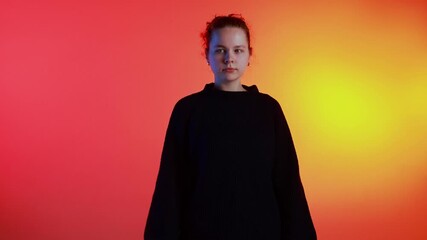 Woman in blue sweater posing thoughtfully on gradient background rotating. Concept of creative editorial portraits, emotional branding visuals, and fashion lookbook content.