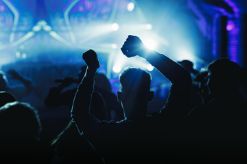 Silhouettes Dancing at Party with Lights