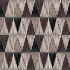 Seamless brown, beige geometric pattern with triangles.