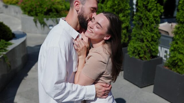 Smiling Couple Embracing Love Portrait of a Young Man and Woman Sharing a Joyful Kis