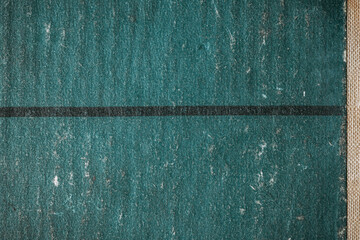Old book cover texture with blue green paper surface, fabric binding strip, and subtle distressed details.